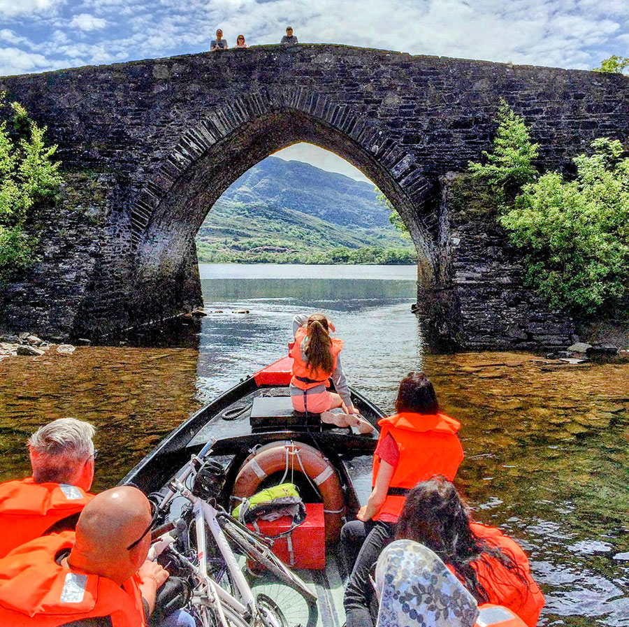 Boat going under bridge - Lakes of Killarney boat tours